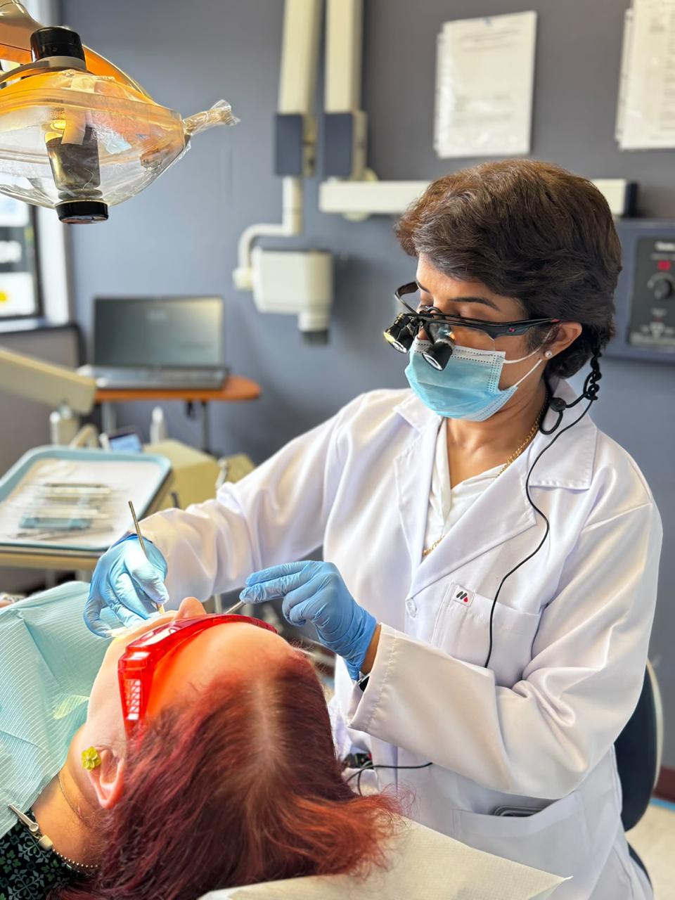 Dr. Sabeen Tiwana treating a patient at Dunbar Smiles