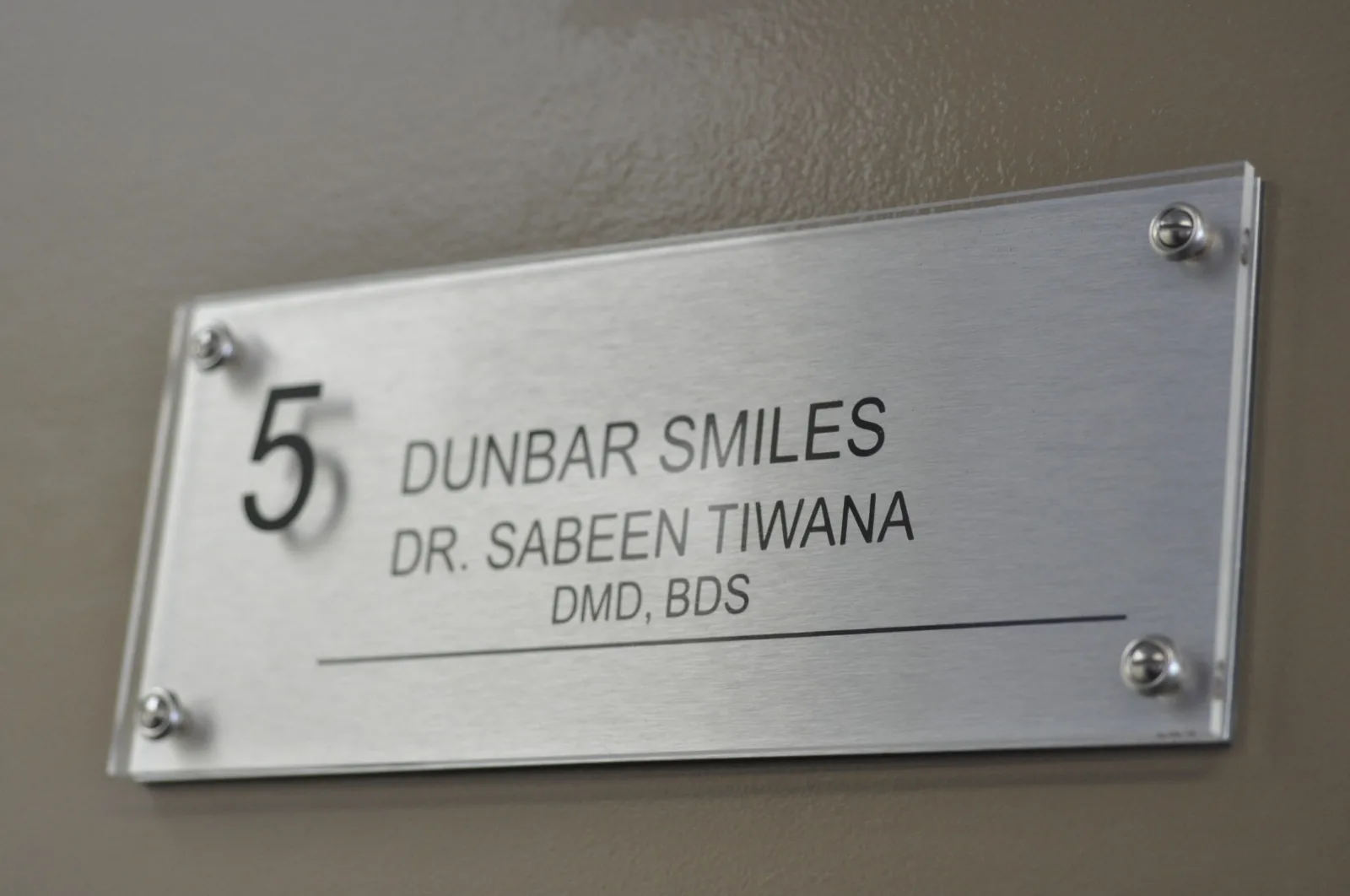 Dunbar Smiles clinic plaque for Dr. Sabeen Tiwana