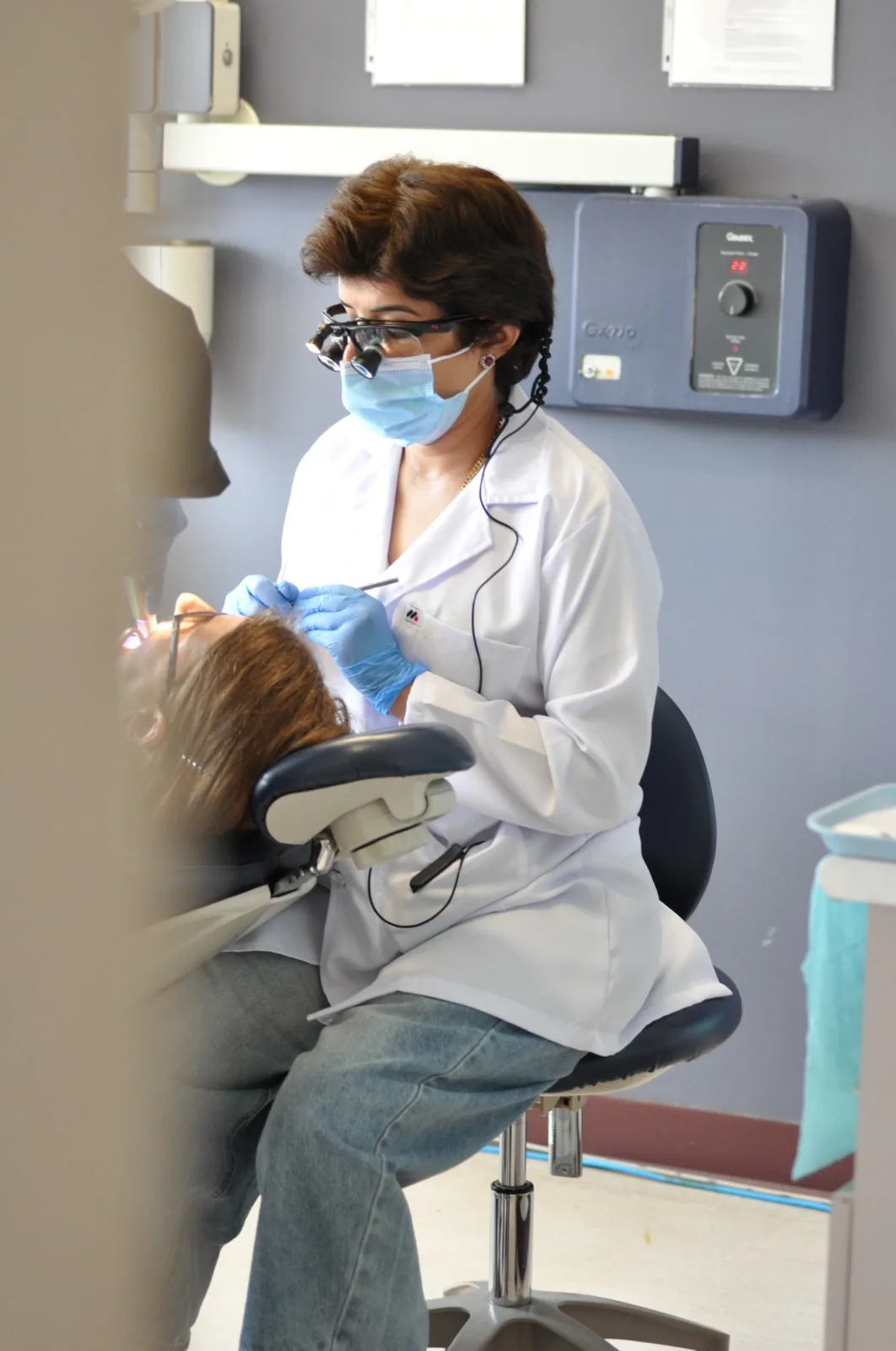 A dentist providing focused chairside treatment